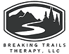 A black and white logo of a trail.