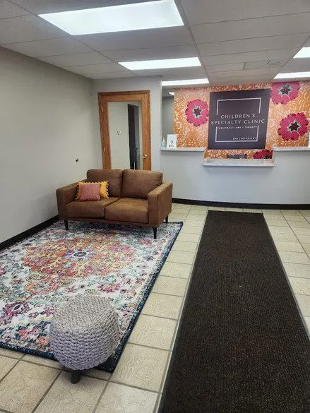 A living room with a couch and rug